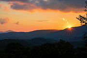 Sun Dips Below the Horizon #1 Photograph by Charles Floyd