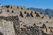 Amidst Ancient Ruins Tourists Explore Machu Picchu Photograph by Travel Essayist