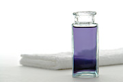 Aromatherapy Essential Oil Bottle and Towel in a Spa Photograph by Olivier Le Queinec
