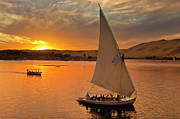 Feluccas at sunset on the river Nile, Egypt Photograph by Neale And Judith Clark