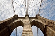 Majestic Brooklyn Bridge Against a Cloudy Sky Photograph by Travel Essayist