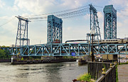Newark Drawbridge carrying NJ Transit train over the Passaic Riv Photograph by Steven Heap
