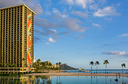 Rainbow tower frames the shore in Waikiki Hawaii Photograph by Steven Heap