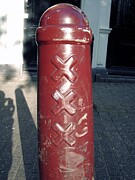 Red Bollard in Amsterdam's Historic Streets Photograph by Travel Essayist