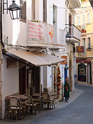 Sitges Spain Cafe Print Cozy Outdoor Seating and Warm Light Color Fine Art Photography Photograph by Travel Essayist