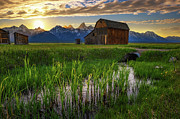 Sunset over a historic barn at Mormon Row in Grand Teton National Park, Wyoming Photograph by Miroslav Liska