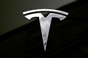 Tesla Emblem Logo Isolated Photograph by Stefano Senise