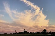 Twilight Whispers Silhouettes of Wind Turbines Against a Vibrant Sky Photograph by Travel Essayist