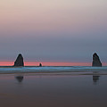 Cannon Beach and Haystack Rock Sunset with a smokey sky Photograph by Bruce Block