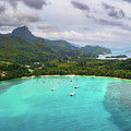 Aerial view of Mahe island with yachts, mountains and Indian Ocean in Seychelles
