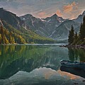 Landscape painting of a calm mountain lake