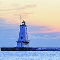 Lighthouse at Sunset Over Calm Waters