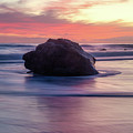 Ocean Swirling Around a Rock at Sunset