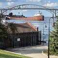 Up Bound Ship under the  Blue Water Bridge, Port Huron Michigan by Lloyd Gillies