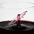 Wine Drops Collide Inside Glass by Charles Floyd